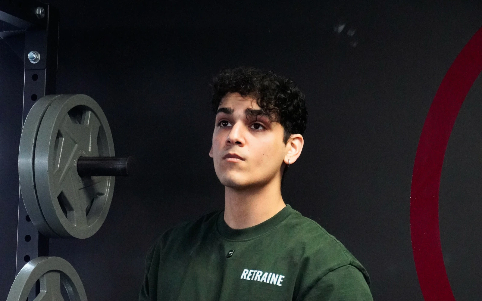 Ammar, founder and head coach of Retraine in Pickering, by the weight rack.